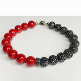 Red Gemstone On Black Ice